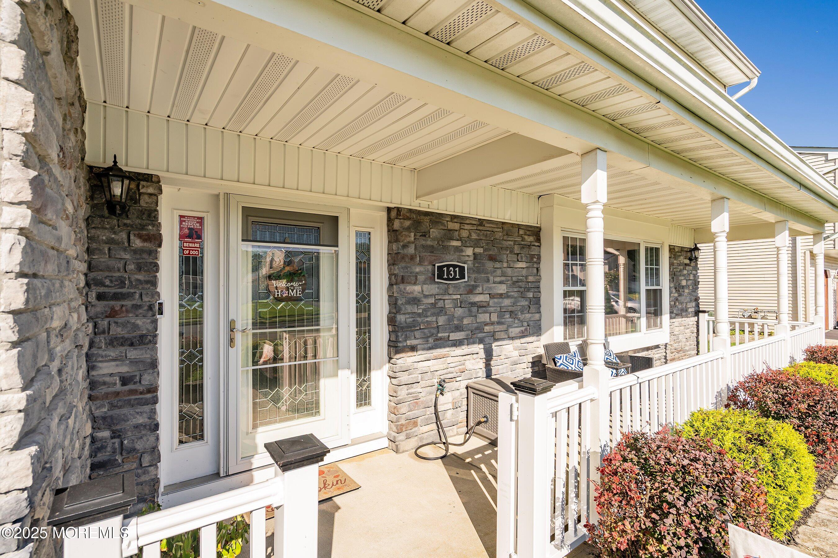 131 Starlight Road Howell, NJ 07731 - Photo 3 of 35 a front view of a house with a large window