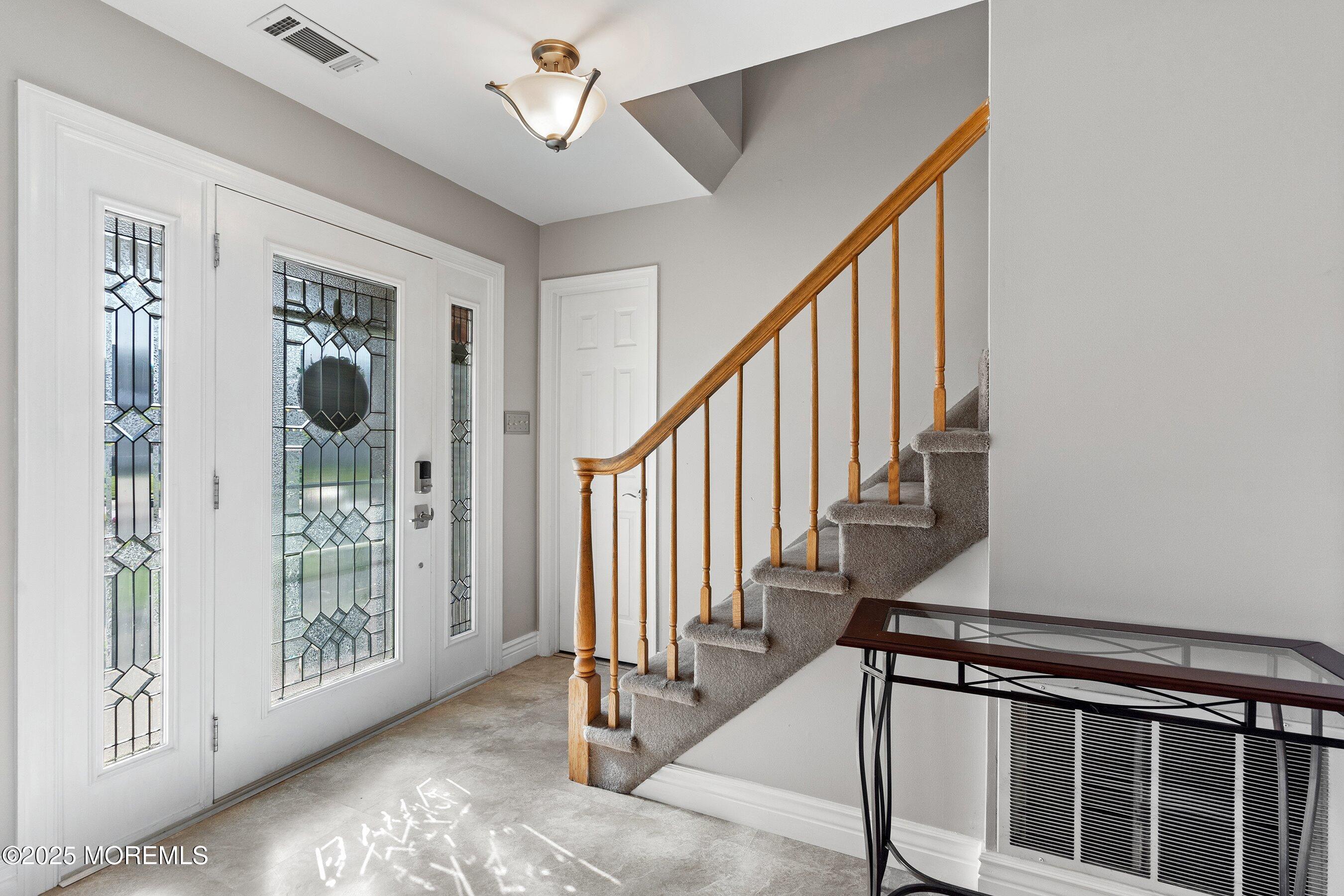 131 Starlight Road Howell, NJ 07731 - Photo 4 of 35 a view of a hallway with wooden floor and entryway