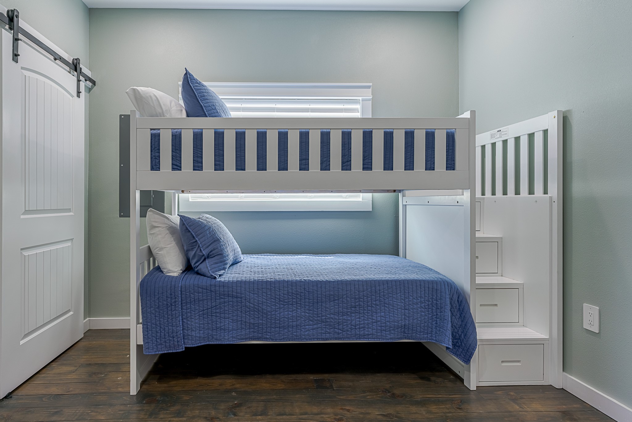 1057 Johnson Road Port Bolivar, TX 77650 - Photo 17 of 40 The bunk room is ready for sleepovers and extra guests, with stacked beds, built-in steps, and a cozy setup everyone can settle into.