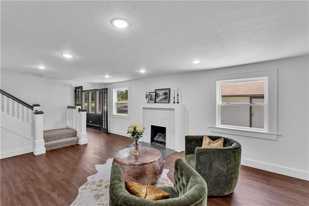 2165 Tuscarawas Road Beaver, PA 15009 - Photo 11 of 39 a living room with fireplace furniture and a wooden floor