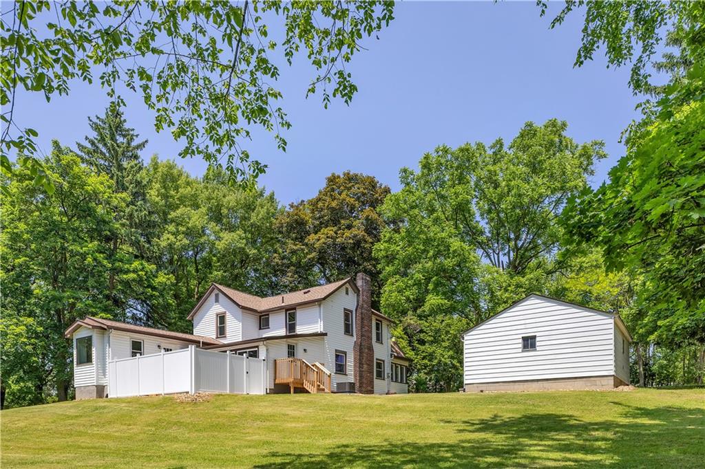 2165 Tuscarawas Road Beaver, PA 15009 - Photo 37 of 39 a front view of a house with a garden and tree