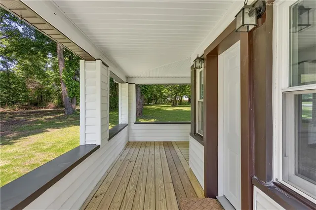 a view of balcony with wooden floor