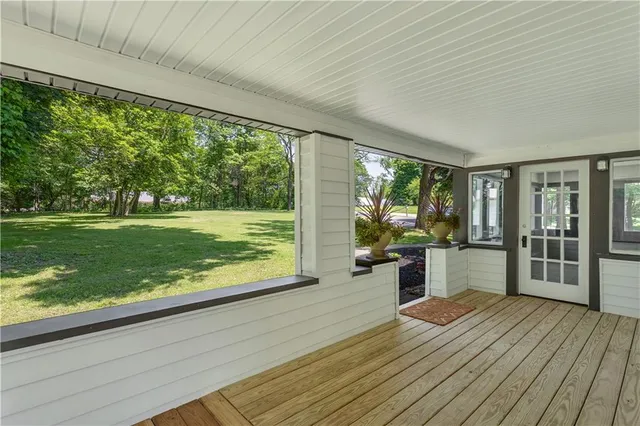a view of a living room and floor to ceiling window or hardwood floor