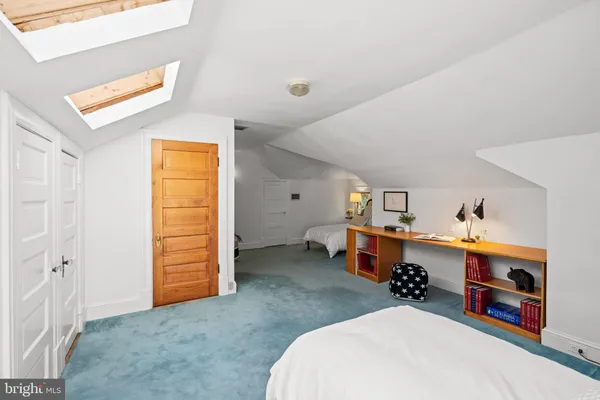 an entryway and livingroom with furniture