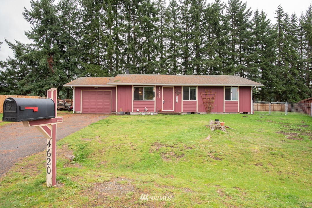 4620 Crescent Court Southwest Rochester, WA 98579 - Photo 1 of 12 a front view of house with yard and green space