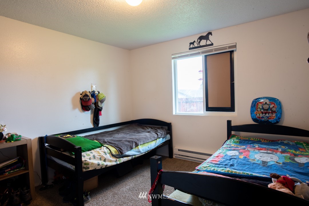 4620 Crescent Court Southwest Rochester, WA 98579 - Photo 6 of 12 a bedroom with bed and a window