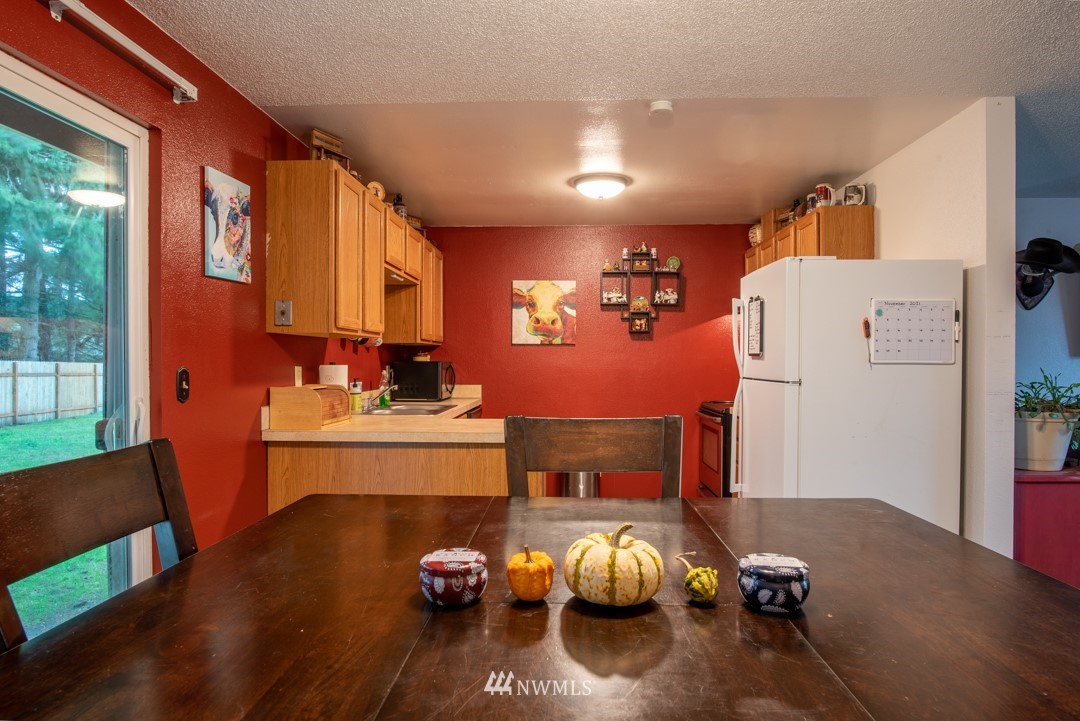 4620 Crescent Court Southwest Rochester, WA 98579 - Photo 7 of 12 a living room with furniture and a wooden floor