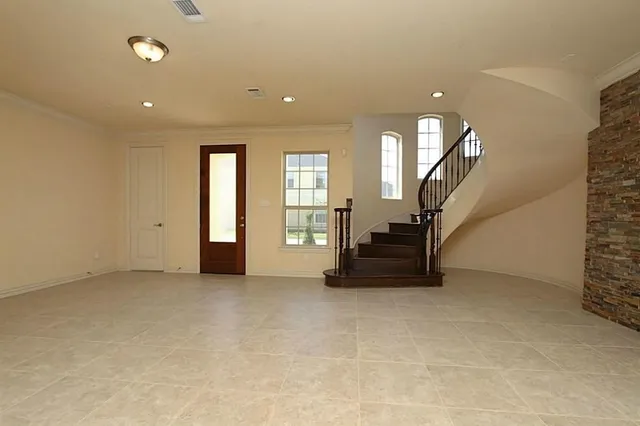 a view of a kitchen with a sink and a refrigerator