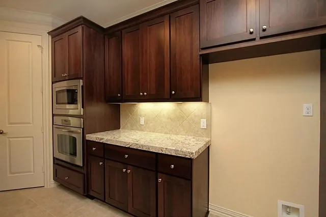 a kitchen with a sink and cabinets