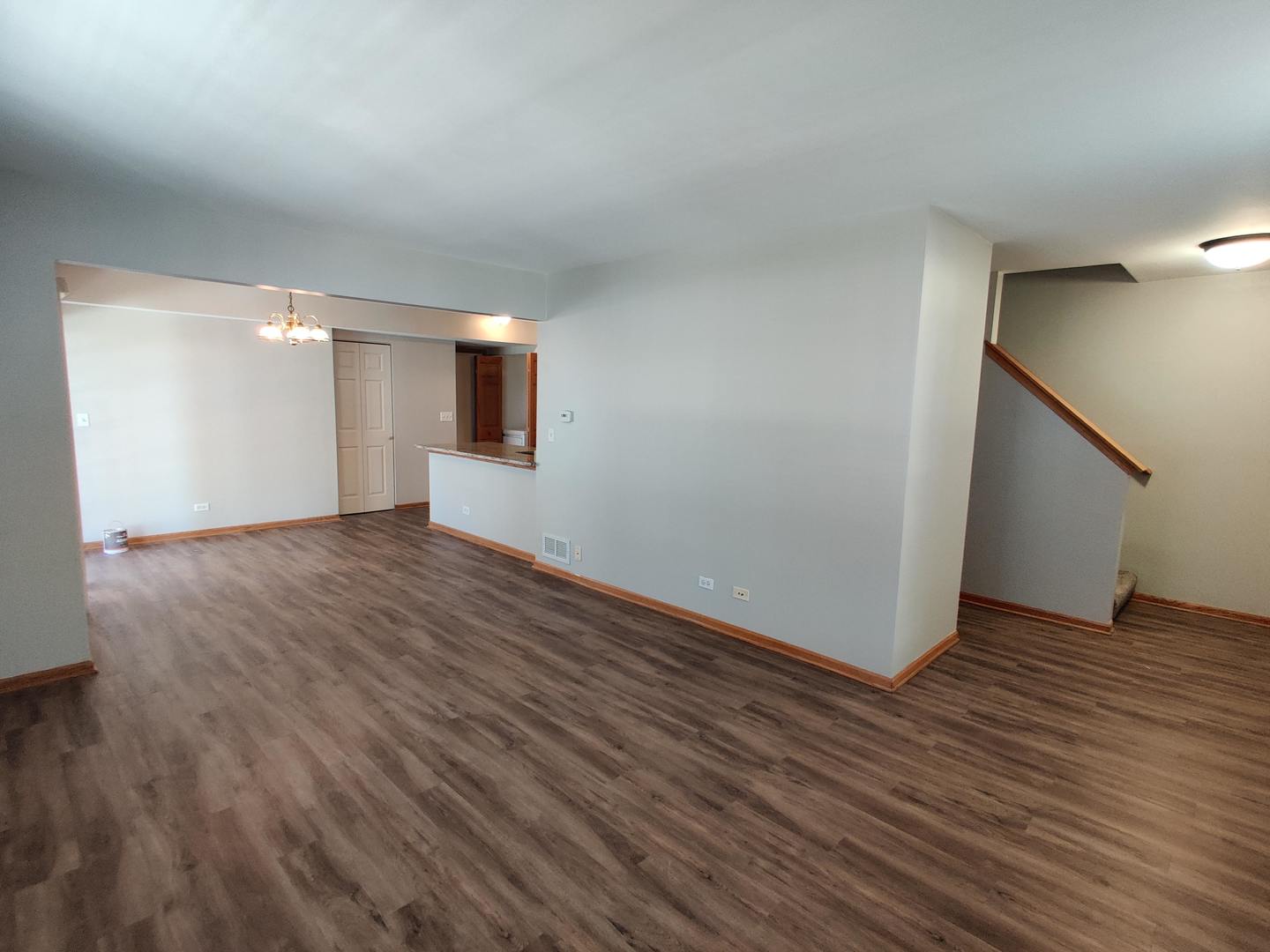 889 Symphony Drive Aurora, IL 60504 - Photo 14 of 24 an empty room with wooden floor and windows