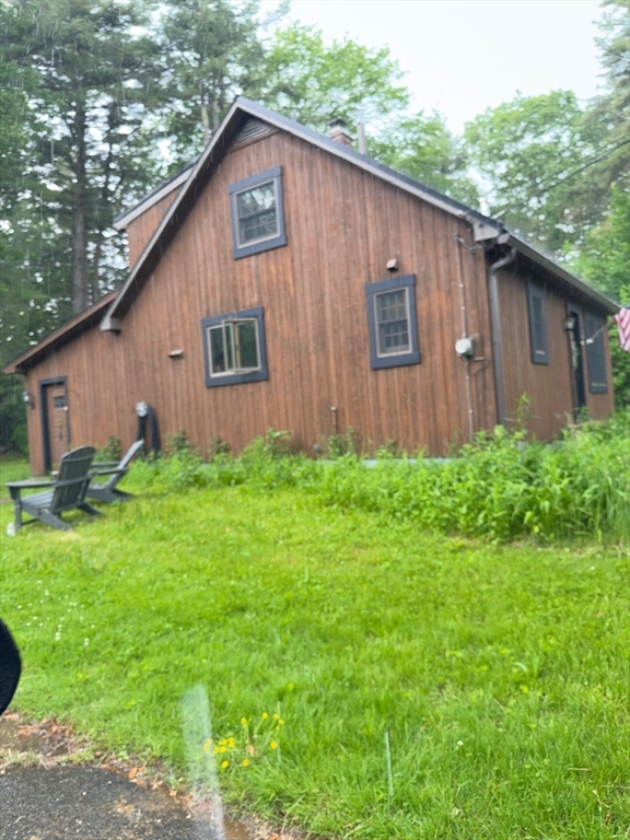 a backyard of a house with lots of green space