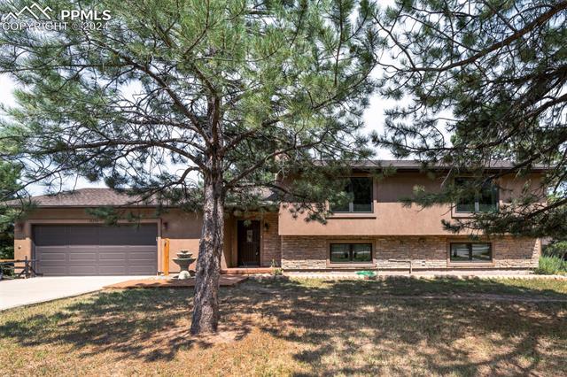 18255 Stoneview Road Monument, CO 80132 - Photo 2 of 42 View of front of property featuring a garage