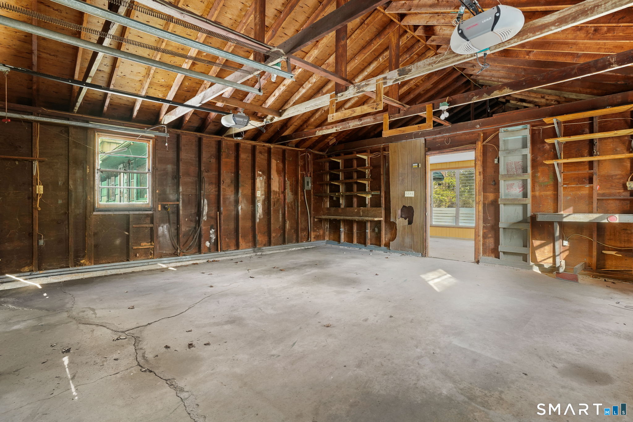 26 George Washington Turnpike Burlington, CT 06013 - Photo 13 of 40 a view of an empty room with wooden walls