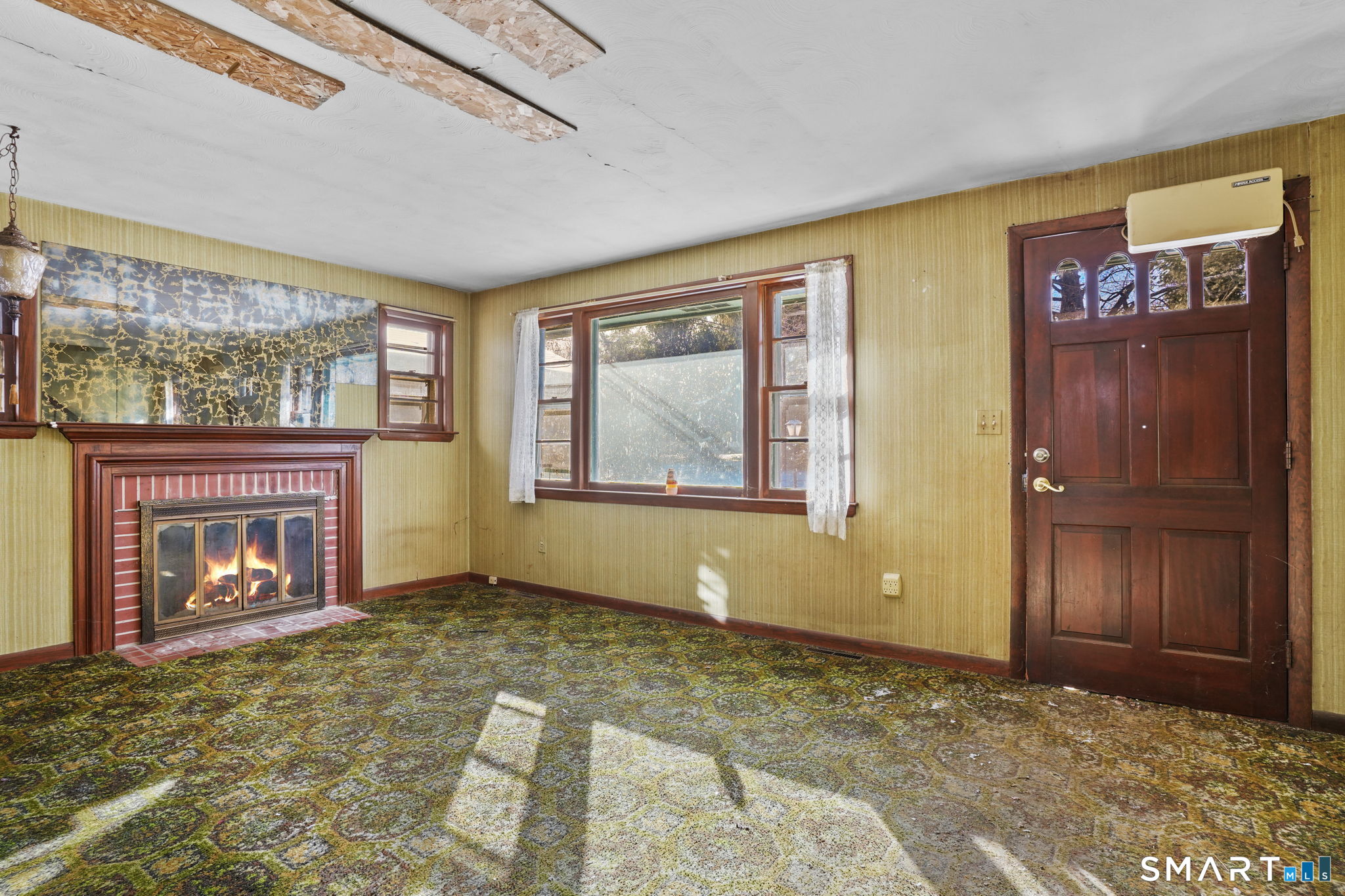 26 George Washington Turnpike Burlington, CT 06013 - Photo 2 of 40 a view of an empty room with window and fire place