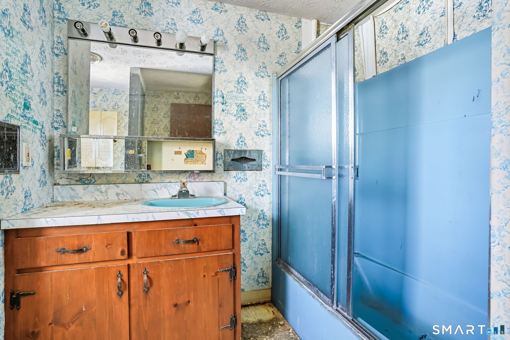 26 George Washington Turnpike Burlington, CT 06013 - Photo 25 of 40 a bathroom with a sink a mirror and a shower