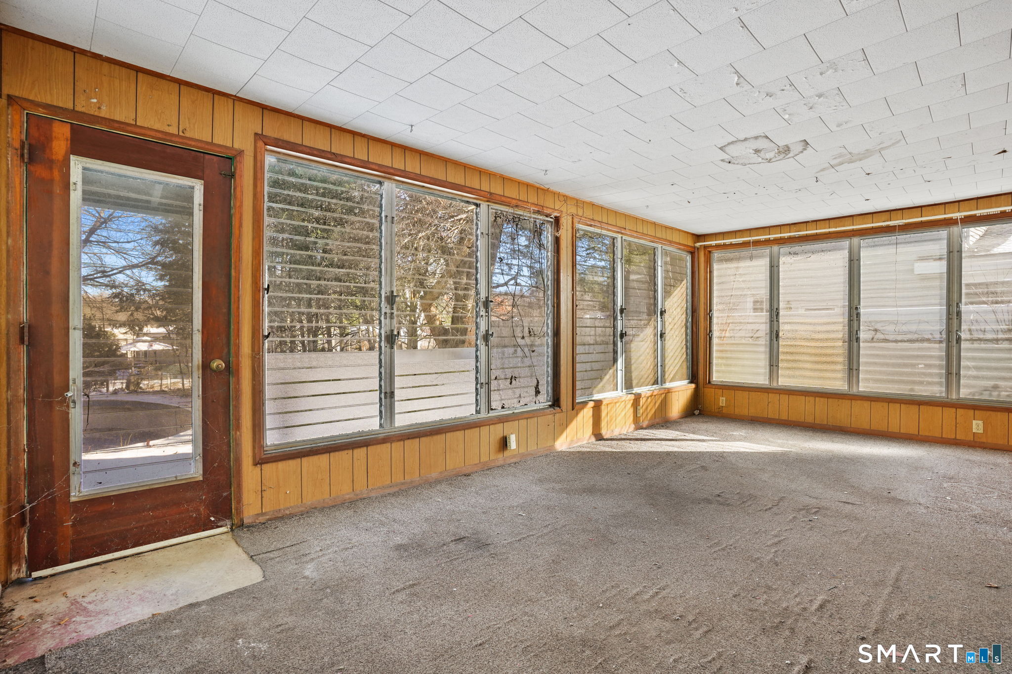26 George Washington Turnpike Burlington, CT 06013 - Photo 10 of 40 a view of an empty room with a fireplace and a large window
