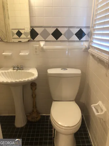 a bathroom with a sink and a toilet
