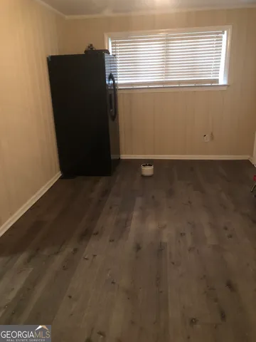 a view of wooden floor and windows in a room