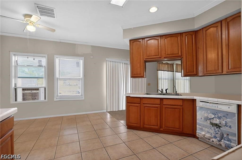 2808 34th Street Southwest Lehigh Acres, FL 33976 - Photo 6 of 14 a kitchen with stainless steel appliances granite countertop a sink dishwasher stove and cabinets