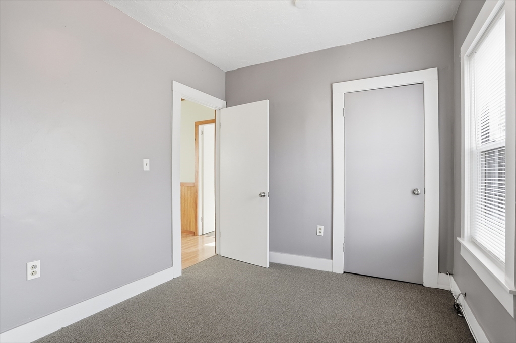 12 Whitcomb Street Webster, MA 01570 - Photo 20 of 40 an empty room with windows and closet
