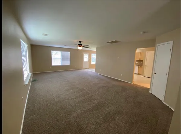 a view of empty room with windows