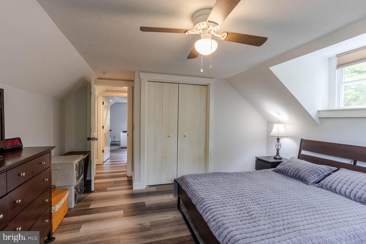 1834 Decker Hollow Road Tyrone, PA 16686 - Photo 29 of 40 a bedroom with a bed and a chandelier