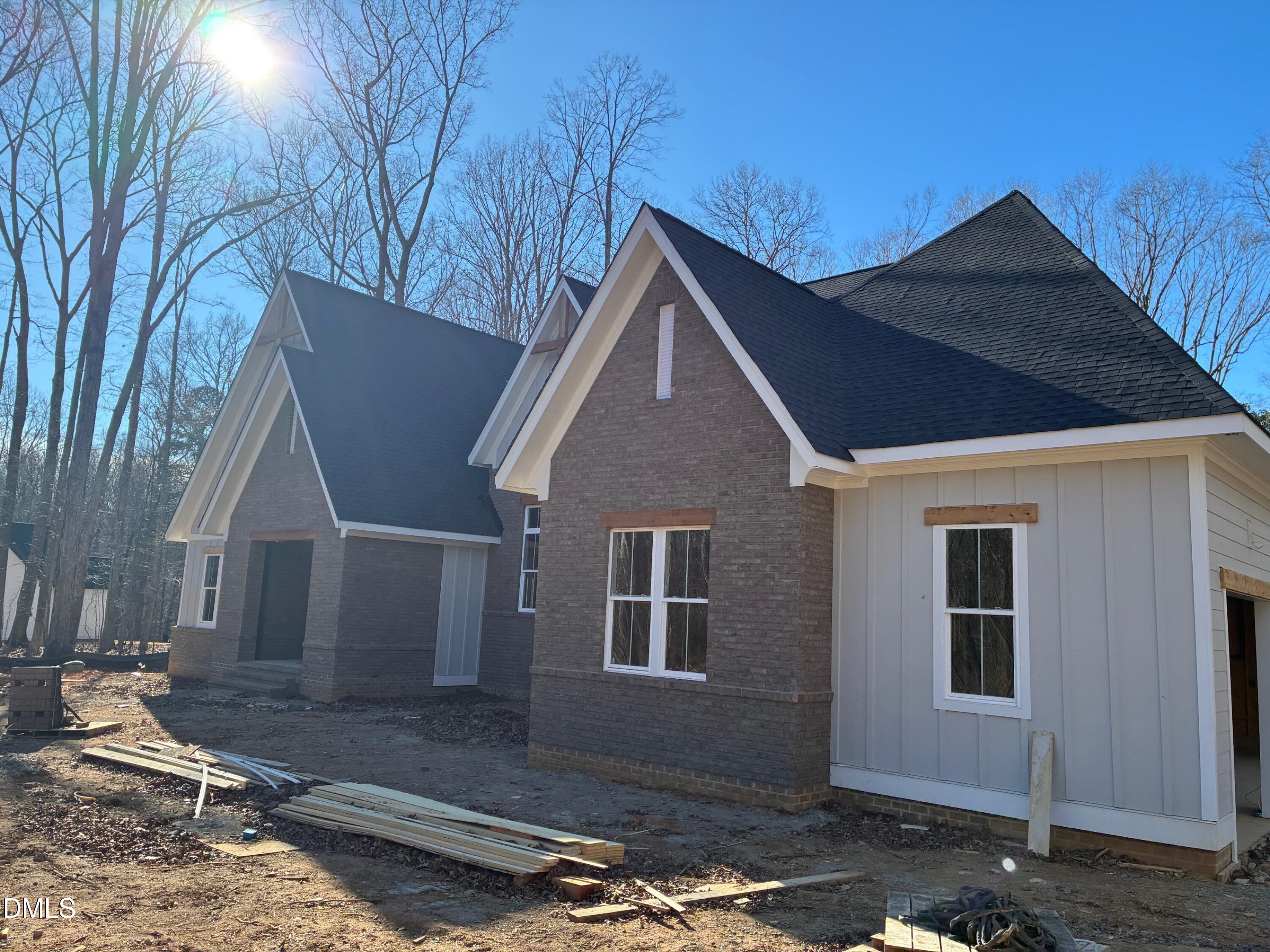 638 Old Goldston Road Pittsboro, NC 27312 - Photo 2 of 12 a front view of a house with a yard