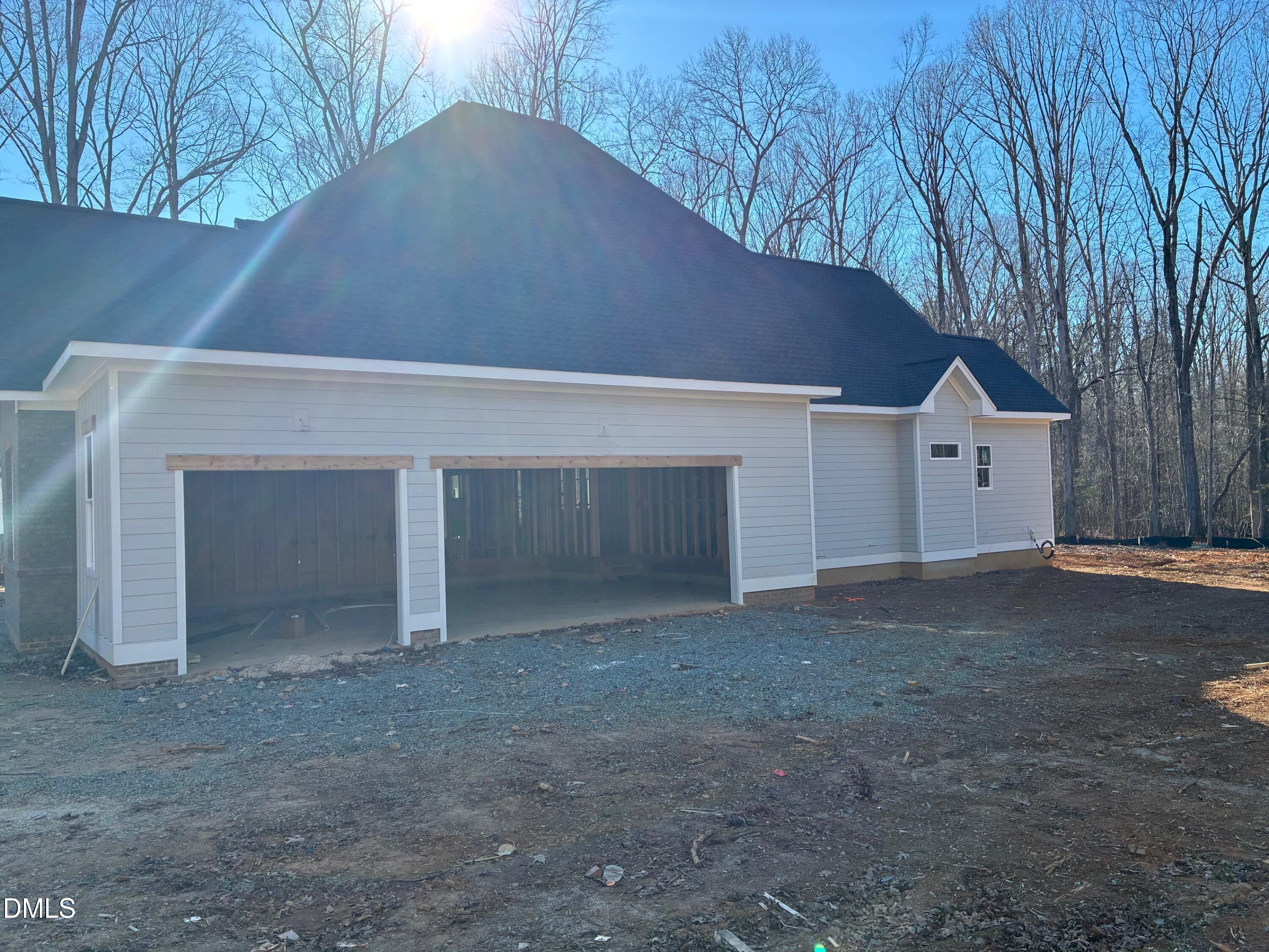 638 Old Goldston Road Pittsboro, NC 27312 - Photo 3 of 12 a view of house with garage and a yard