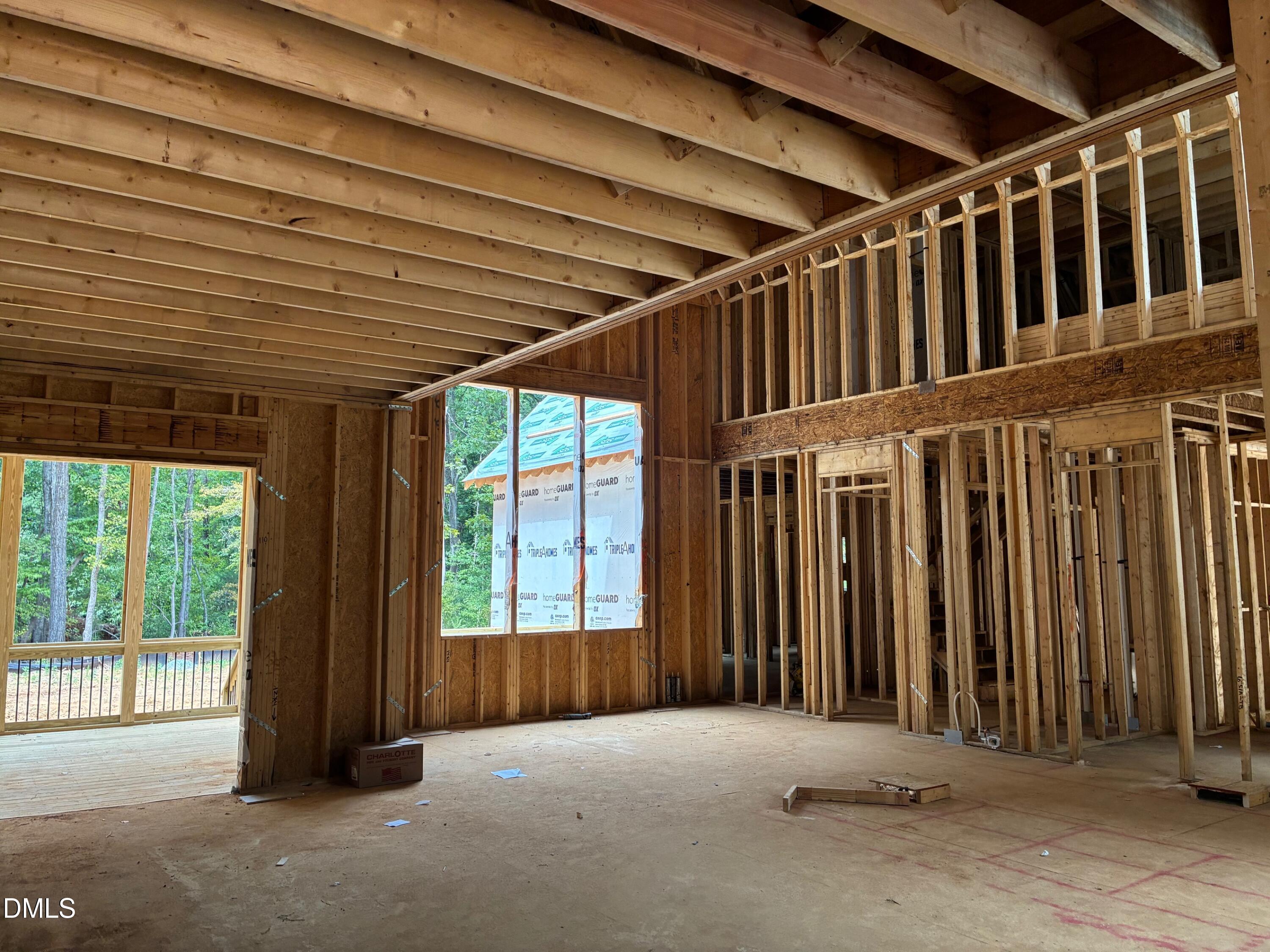 638 Old Goldston Road Pittsboro, NC 27312 - Photo 5 of 12 a view of an empty room with wooden floor and stairs