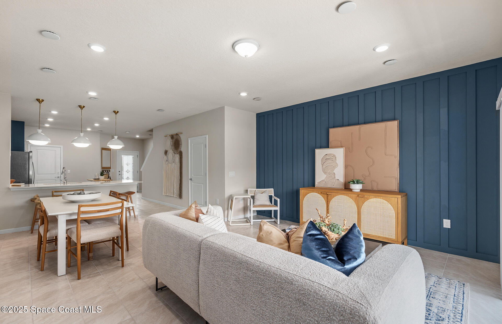 4313 Jetty Lane Palm Bay, FL 32905 - Photo 12 of 16 a living room with furniture a mirror and piano table