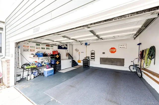 a bed sitting in a balcony next to a yard