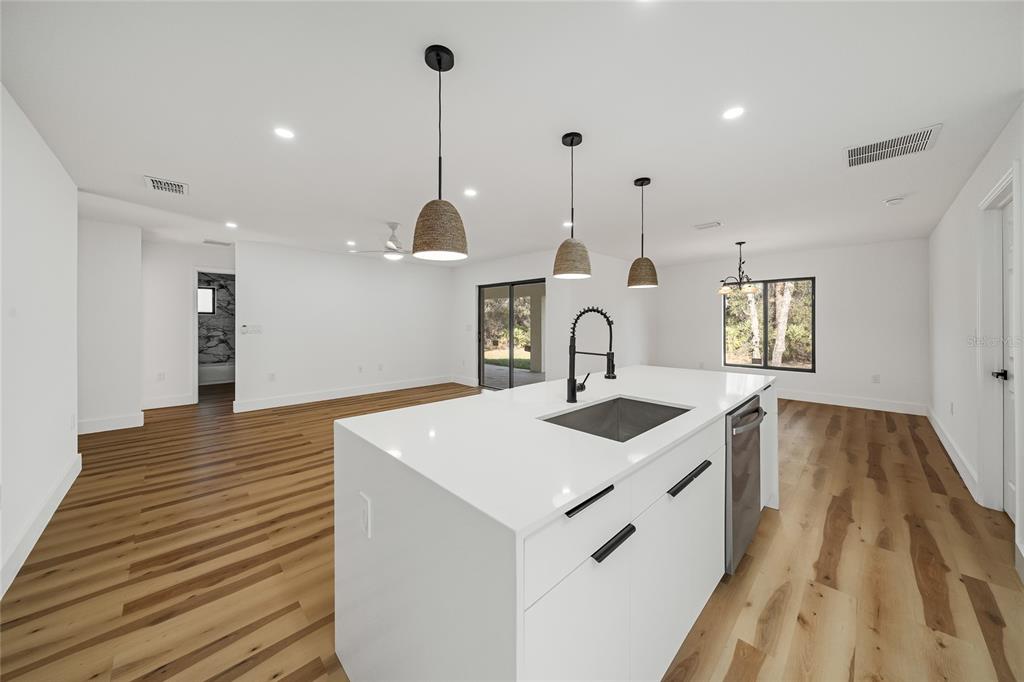 15460 Chamberlain Boulevard Port Charlotte, FL 33953 - Photo 5 of 23 a kitchen with a sink and a stove
