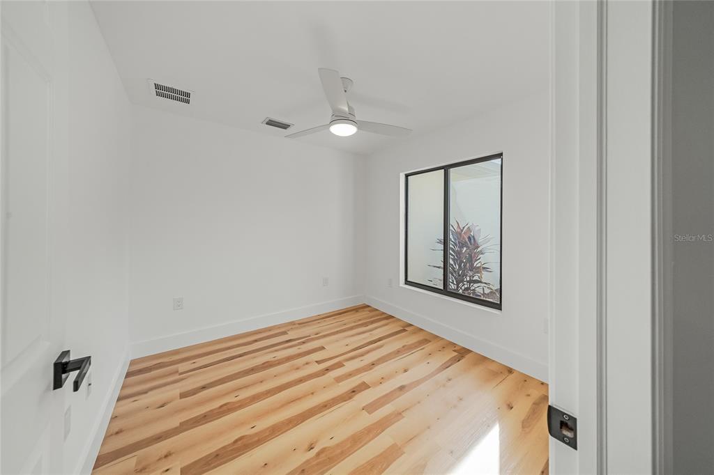 15460 Chamberlain Boulevard Port Charlotte, FL 33953 - Photo 9 of 23 a bedroom with a bed and a window