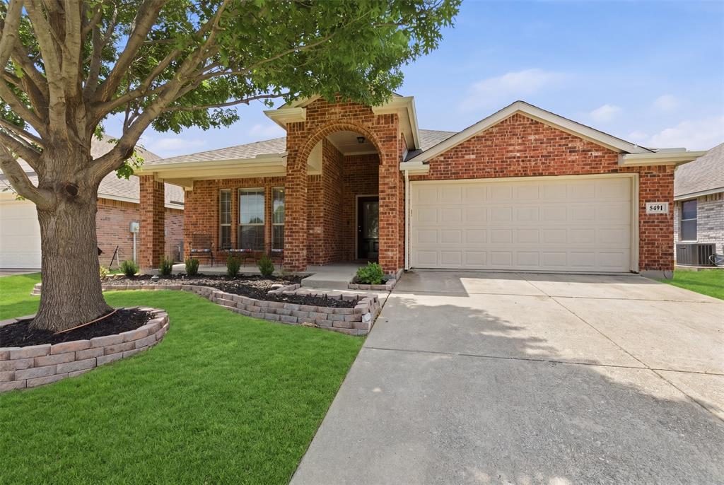 5491 Exeter Drive Prosper, TX 75078 - Photo 20 of 20 a front view of a house with garden