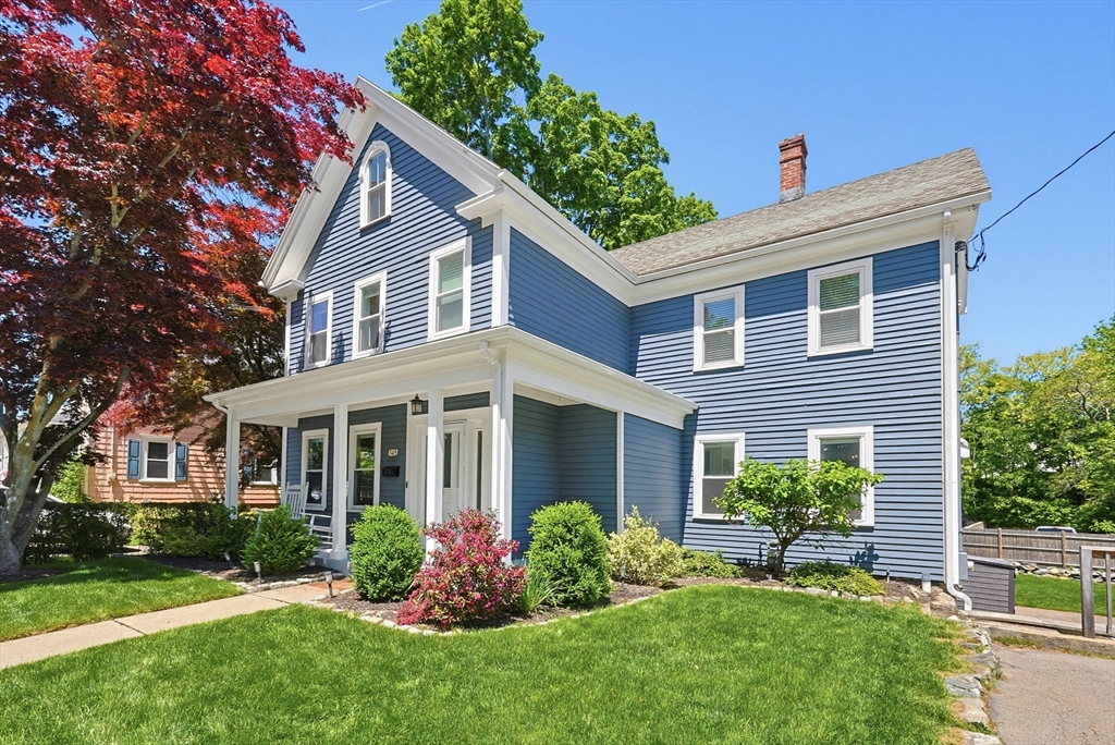 345 Sherman Street Canton, MA 02021 - Photo 2 of 42 a front view of a house with a yard and potted plants