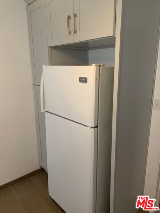 312 South Reeves Drive, Unit E Beverly Hills, CA 90212 - Photo 10 of 10 a white refrigerator freezer sitting in a kitchen