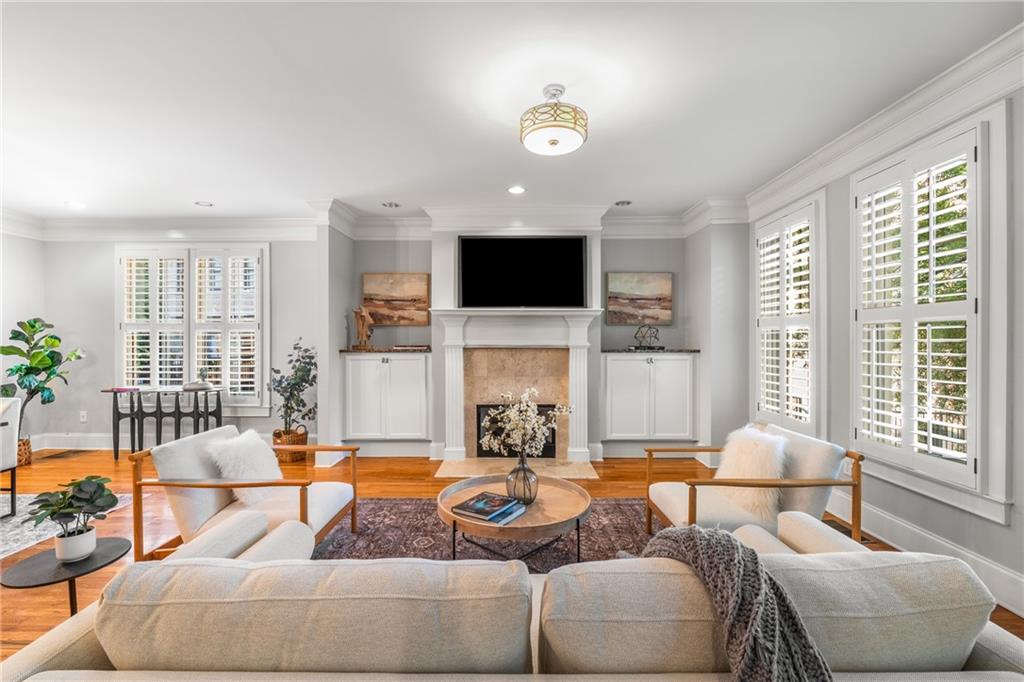 102 Knob Hills Circle Decatur, GA 30030 - Photo 1 of 1 a living room with fireplace furniture and a large window