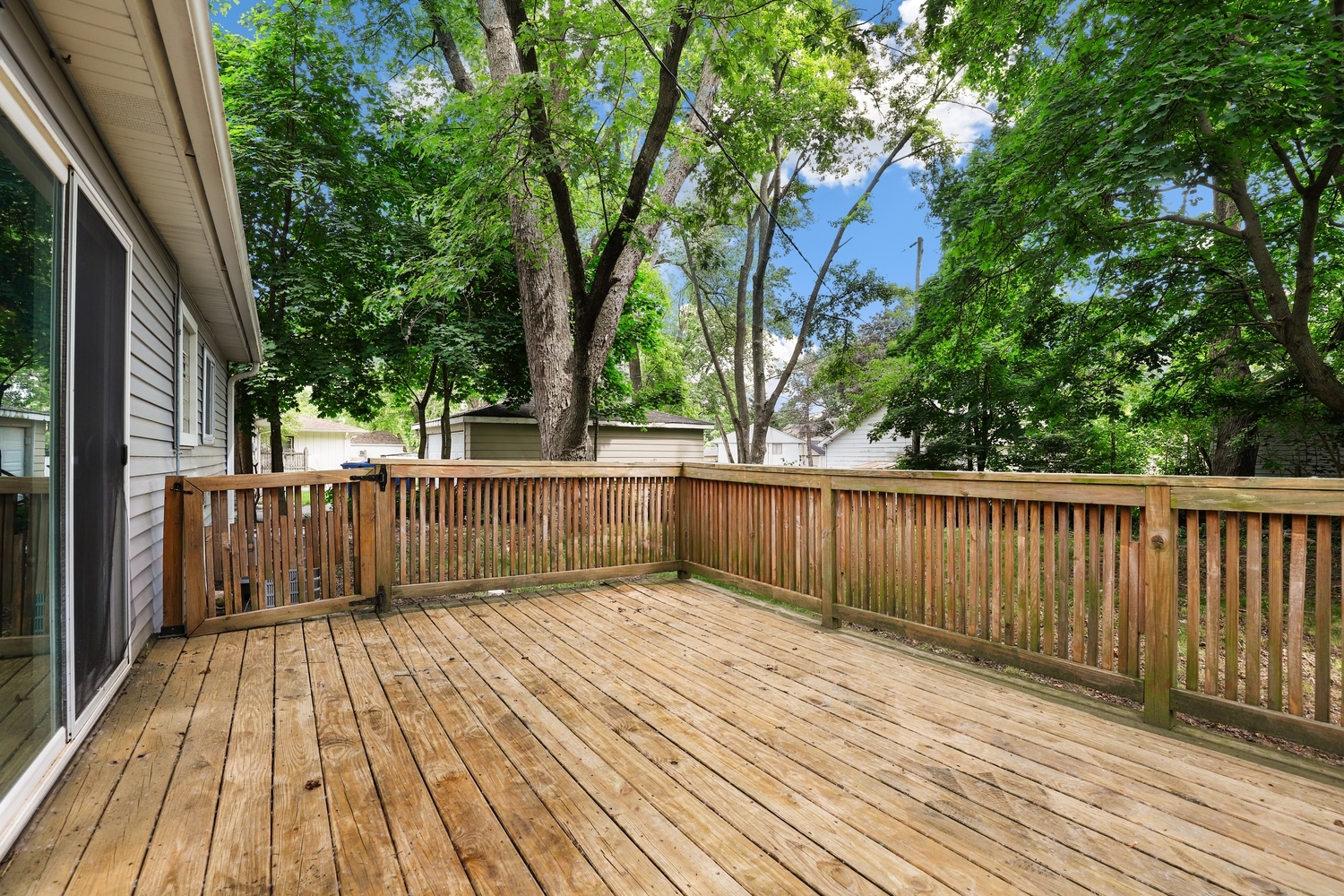 231 West 35th Street Steger, IL 60475 - Photo 15 of 17 a view of balcony with wooden floor and fence