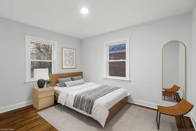 a bedroom with a bed and chair