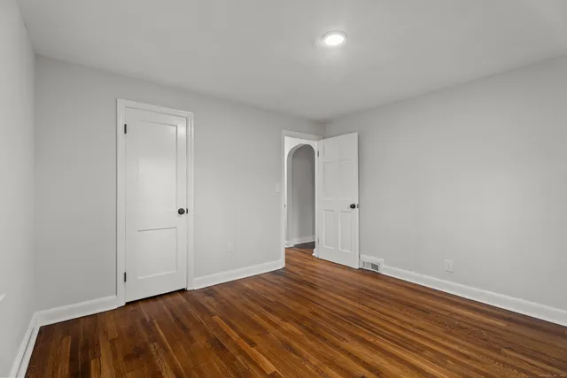 a view of room with wooden floor