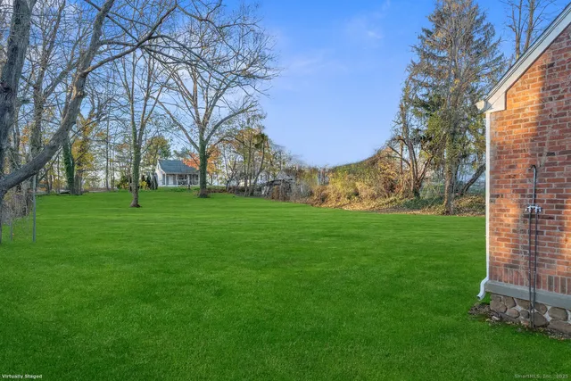 a view of a park with large trees