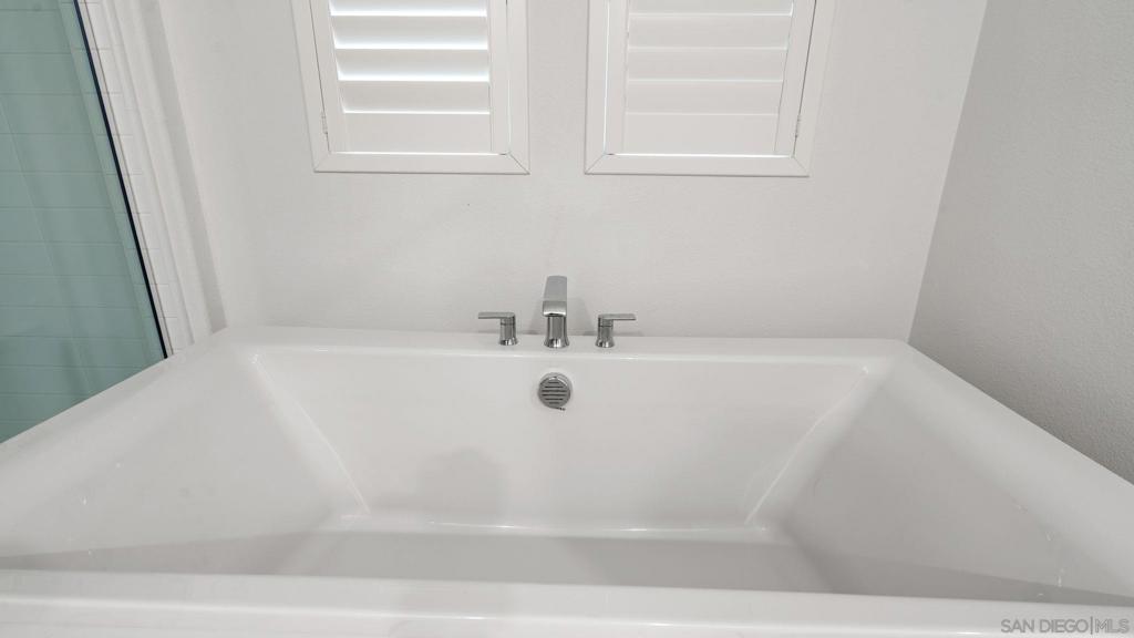 15681 Rennyson Way San Diego, CA 92127 - Photo 14 of 36 a view of a bathtub in a bathroom