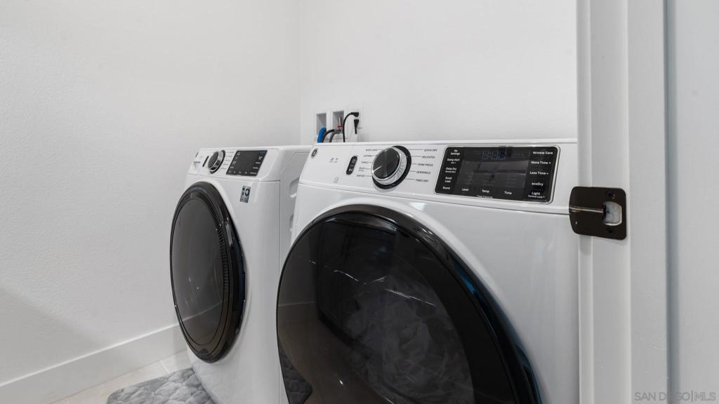 15681 Rennyson Way San Diego, CA 92127 - Photo 23 of 36 a utility room with dryer and washer