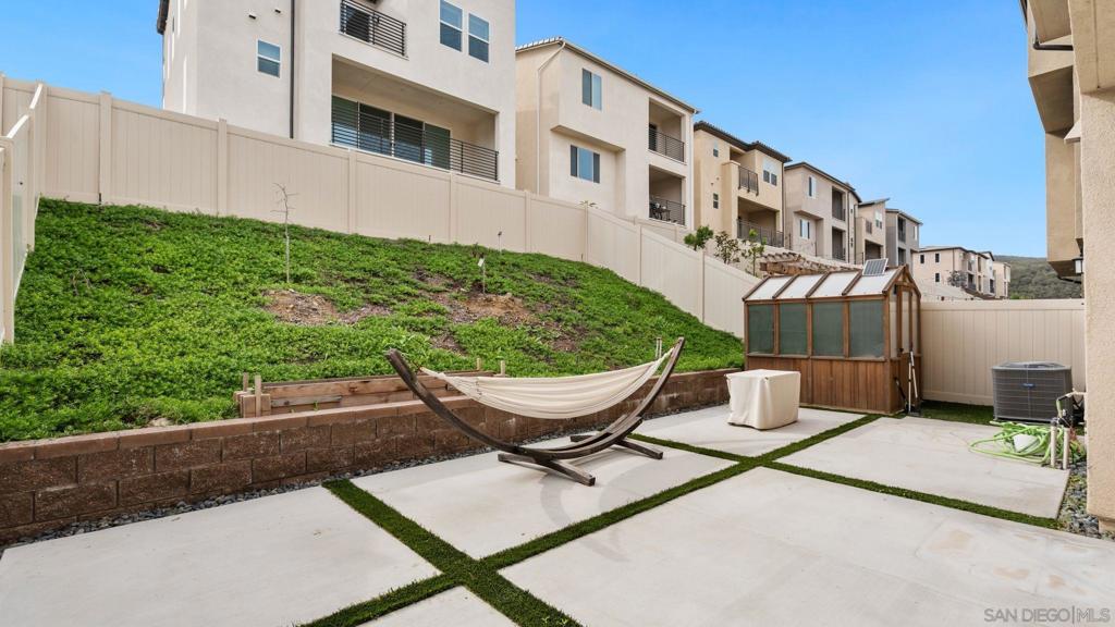 15681 Rennyson Way San Diego, CA 92127 - Photo 34 of 36 a view of a patio with a table and chairs