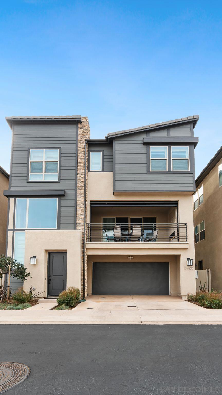 15681 Rennyson Way San Diego, CA 92127 - Photo 36 of 36 a living room with a fireplace and a fireplace
