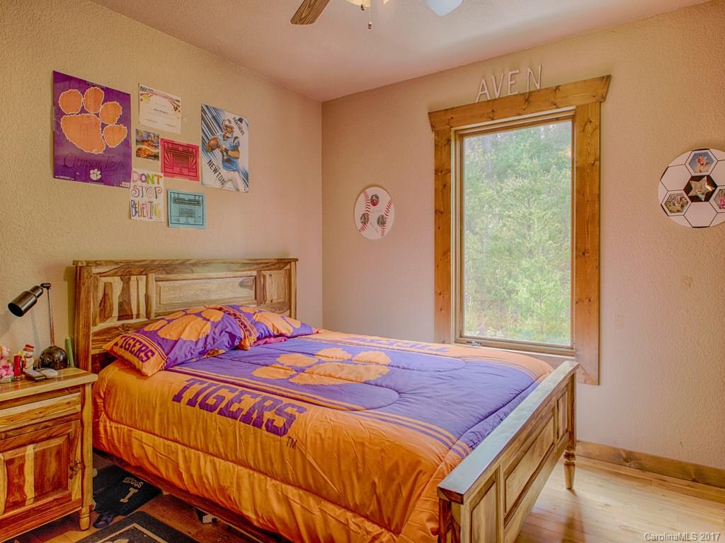 295 Rice Cove Road Canton, NC 28716 - Photo 20 of 24 a bedroom with a bed and a window