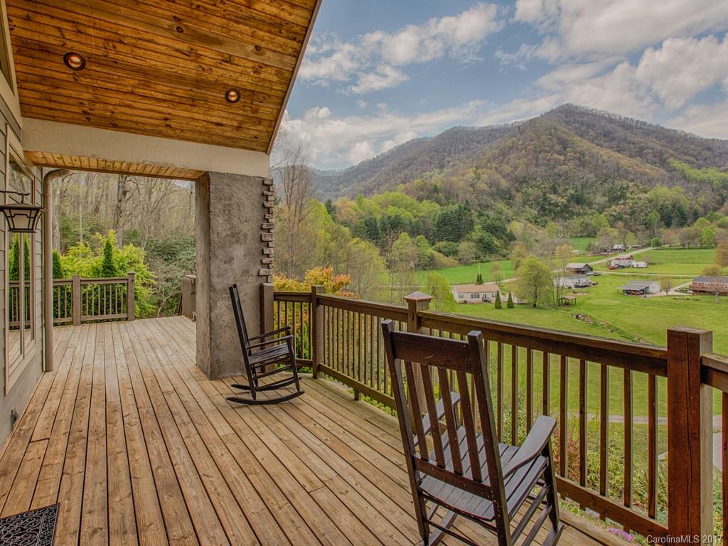 295 Rice Cove Road Canton, NC 28716 - Photo 6 of 24 a view of a balcony with wooden floor & fence
