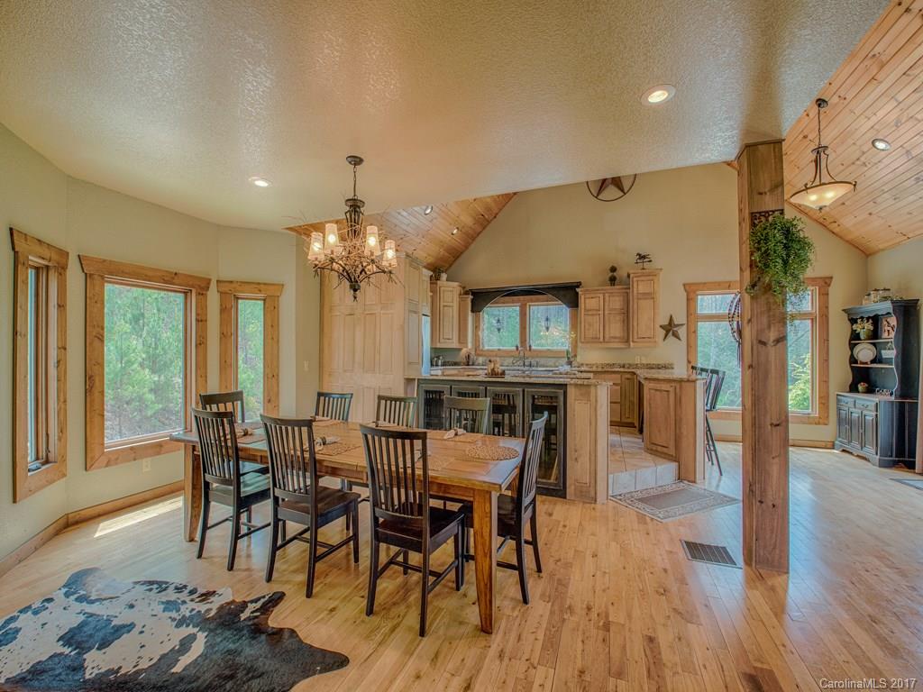 295 Rice Cove Road Canton, NC 28716 - Photo 8 of 24 a view of a dining room with furniture window and wooden floor