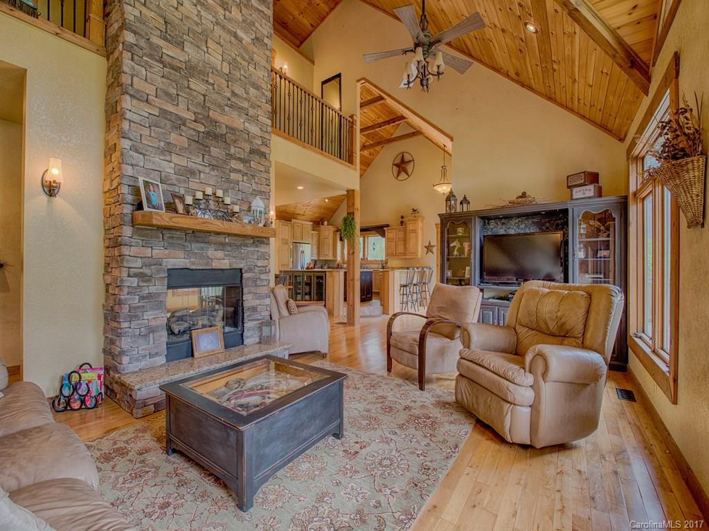 295 Rice Cove Road Canton, NC 28716 - Photo 10 of 24 a living room with furniture and a fireplace
