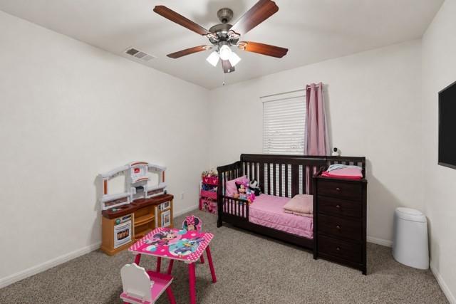 109 Ruby Circle Hewitt, TX 76643 - Photo 11 of 14 a bedroom with furniture and a chandelier fan